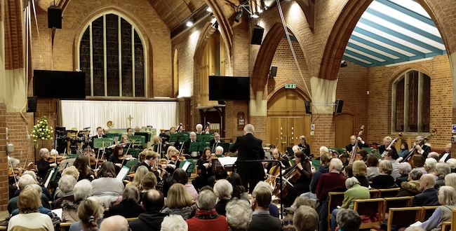 The Surrey Philharmonic Orchestra conducted by 
		Rupert Bond performing to a large audience in Ashtead 1 March 2025