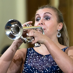 Picture of soloist: Matilda Lloyd, playing Haydn’s Trumpet Concerto with the SPO